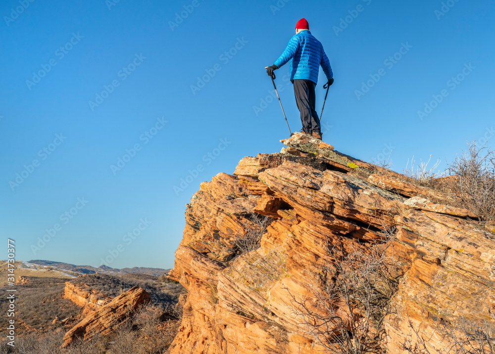 Male hiker on a sandstone cliff