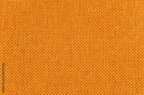 Orange fabric texture background, close-up
