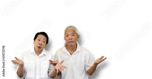 Asian elder old couple unhappy angry with situation copy space