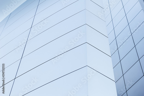 A view of a metal wall on a building with modern architecture.