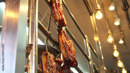 Photography Hong Kong honey glazed barbecue roasted pork hannging in Cantonese restaurant
