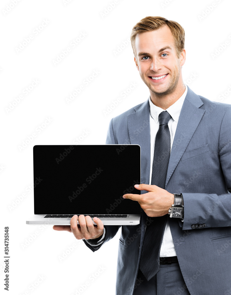 Smiling businessman in grey confident suit, showing blank laptop monitor, isolated over white background, with copy space area for some slogan, imaginary, ad or text. Smiling businessman in grey confident suit, showing blank laptop monitor, isolated over white background, with copy space area for some slogan, imaginary, ad or text.