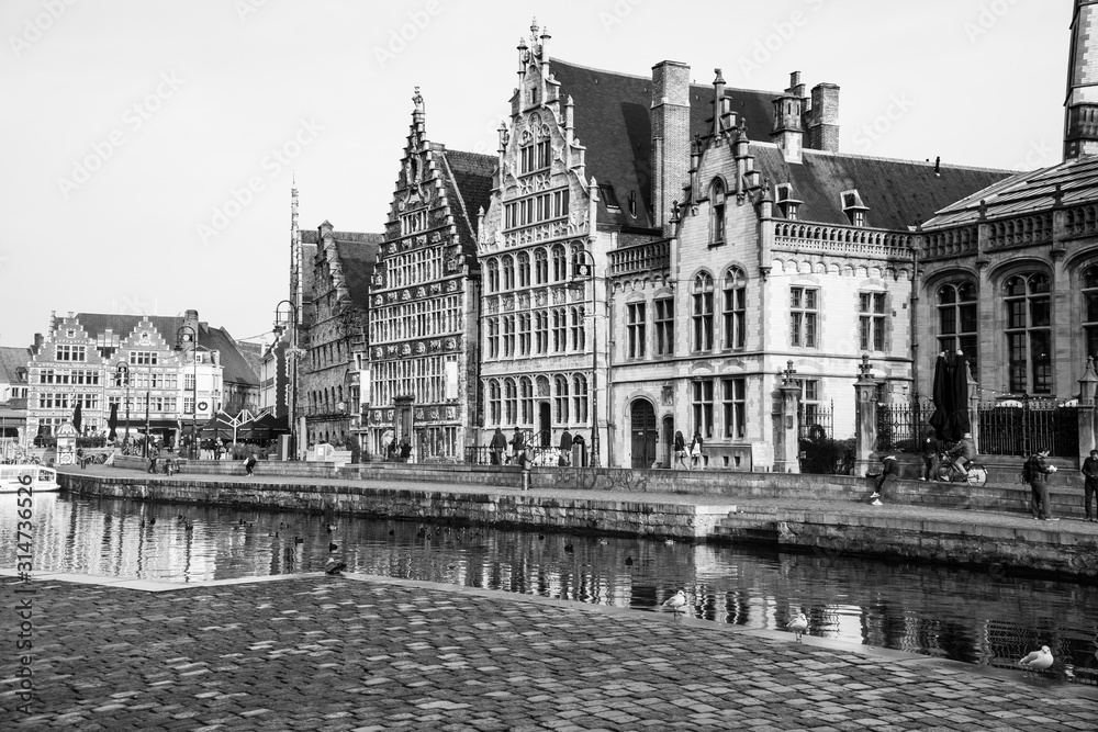 the city of Belgium , Ghent with the river and the landmark buildings crossing and feels like being in medieval era 