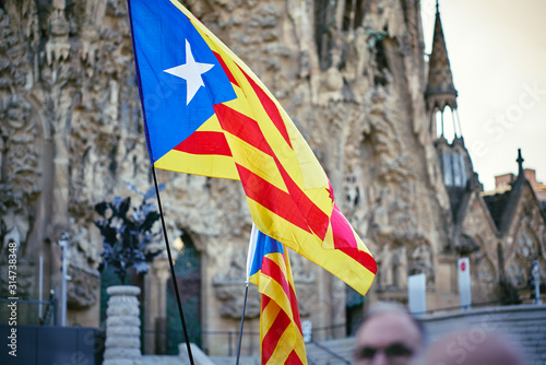 Demonstrations and protests against Spain government and in favour of independence took place in Barcelona. People gather to protest wobbling flags with the Sagrada Familia in the background photo