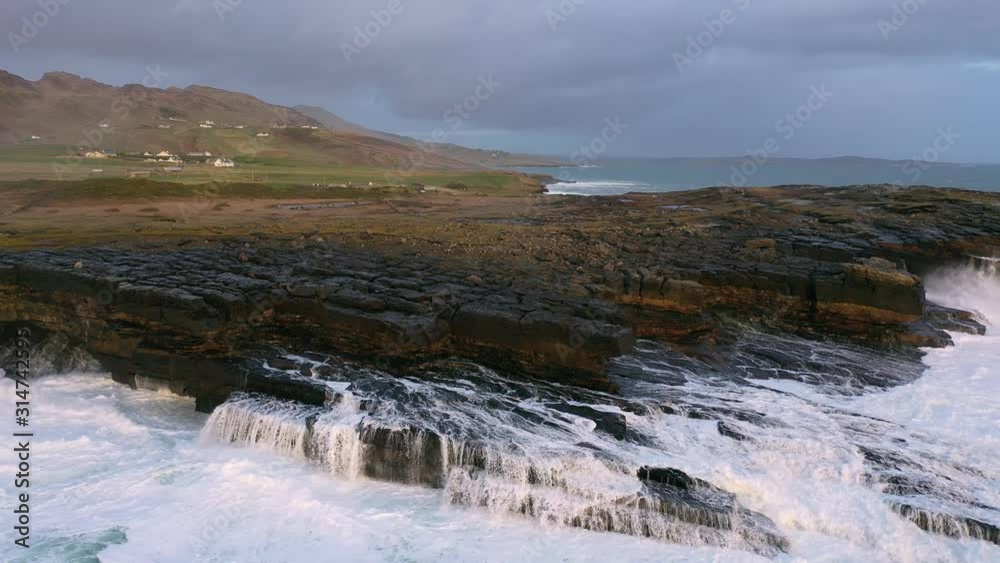 Huge waves breaking at Muckross Head - A small peninsula west of Killybegs, County Donegal, Ireland. The cliff rocks are famous for climbing Huge waves breaking at Muckross Head - A small peninsula west of Killybegs, County Donegal, Ireland. The cliff rocks are famous for climbing