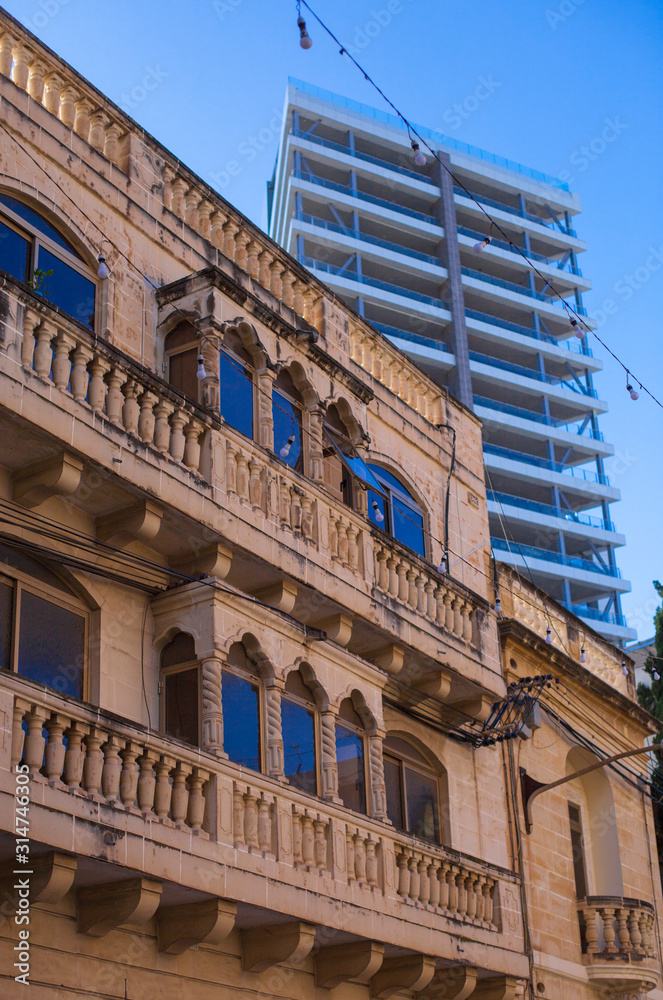 old building in front of a new one