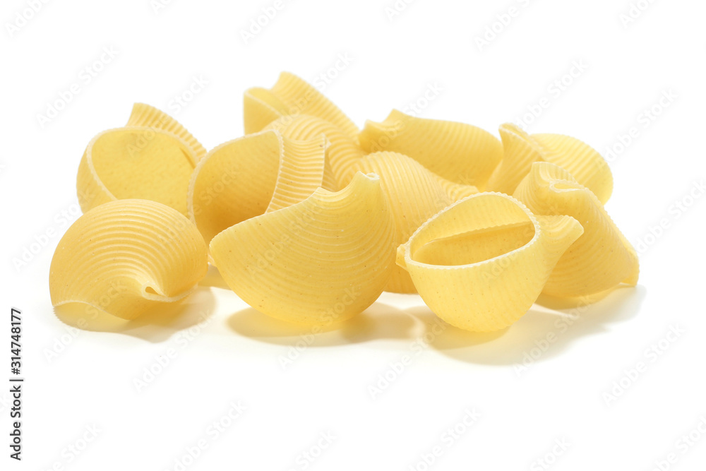 A lot of italian's raw pasta(macaroni) conchiglie on a white background