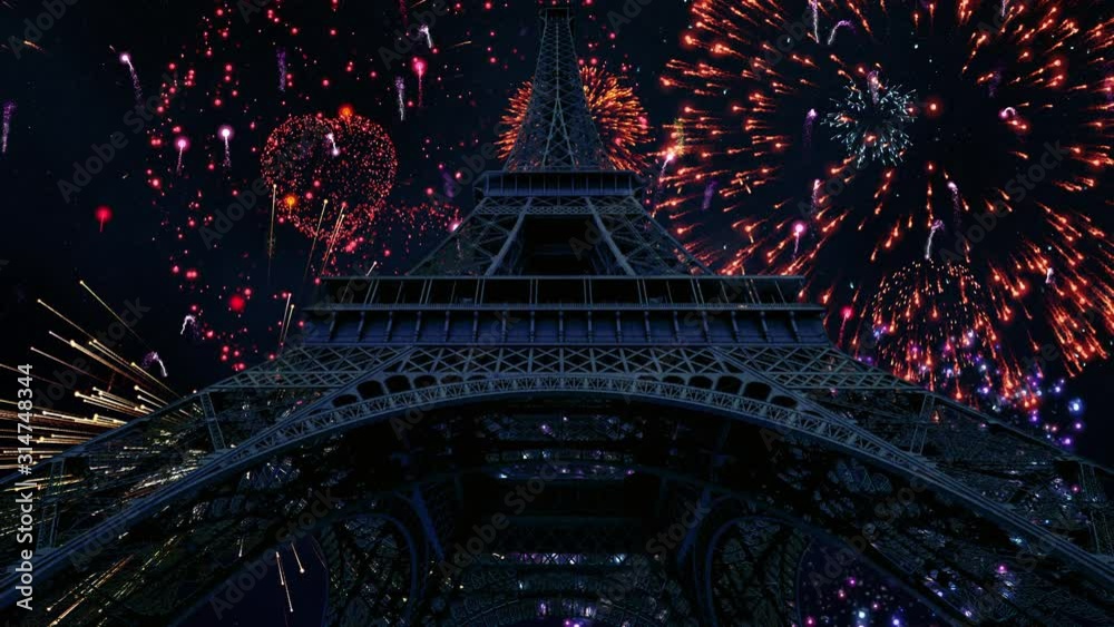 Massive fireworks display on a clear starry night over the Eiffel Tower in Paris, France.