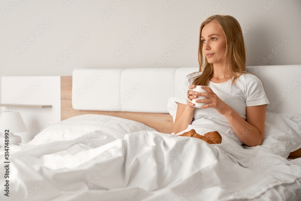 Girl enjoying breakfast in bed. Girl enjoying breakfast in bed.