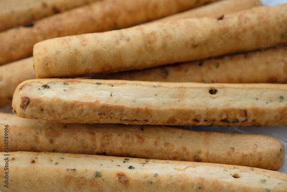 Delicious Italian bread sticks in plastic packaging. grissini snack top view.