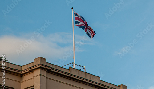 Union flag flying against a blue sky (Union Jack)