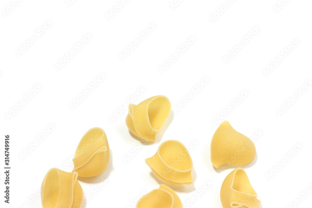 A lot of italian's raw pasta(macaroni) conchiglie on a white background