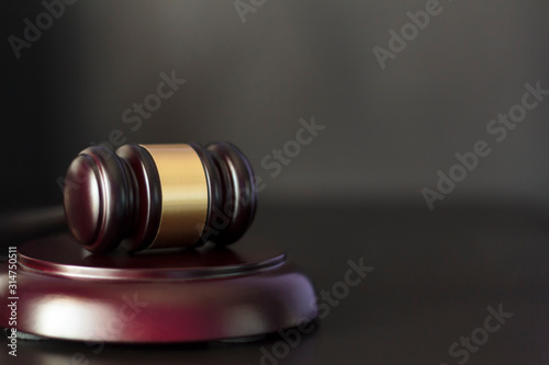 Judge's gavel on black background with copy space. Justice and law concept