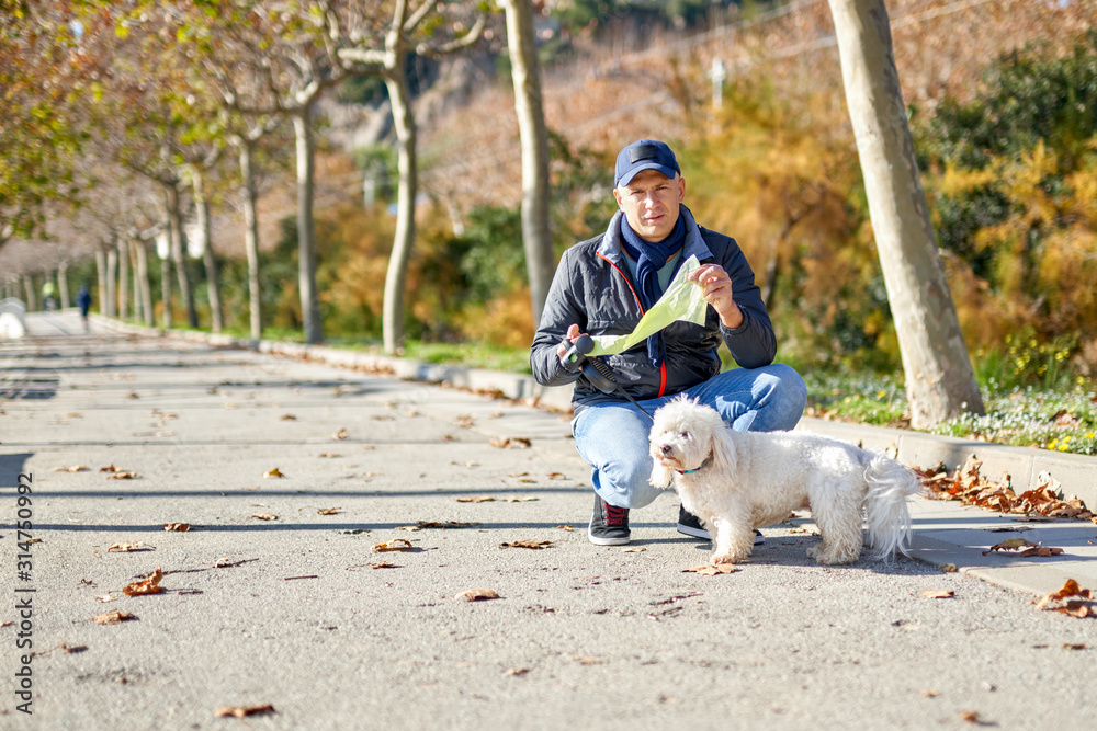man white small dog walk park