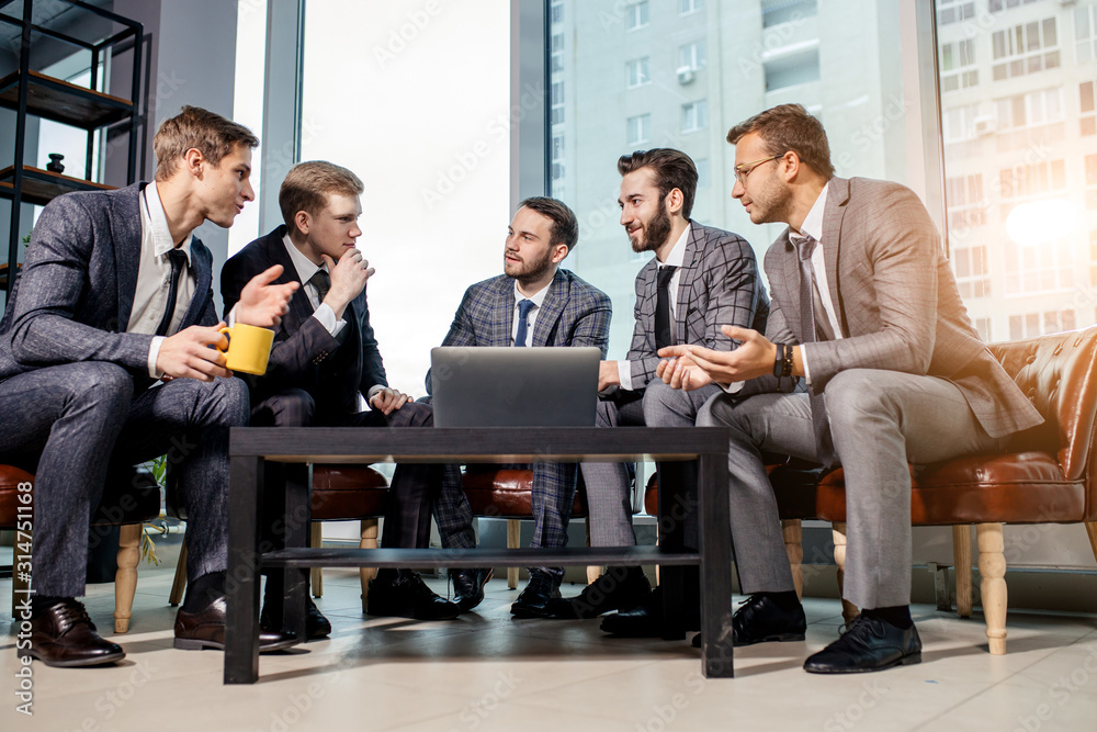 young men in suits gathered in business meeting for discussing together business strategies, developing new strategy for future year or month young men in suits gathered in business meeting for discussing together business strategies, developing new strategy for future year or month