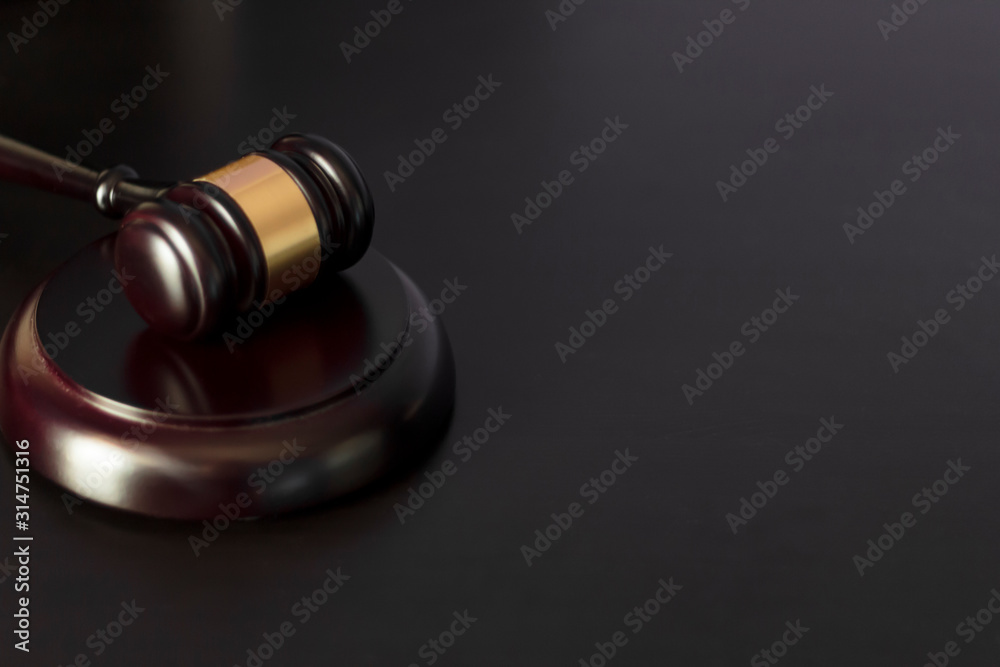 Judge's gavel on black wooden table with copy space Judge's gavel on black wooden table with copy space