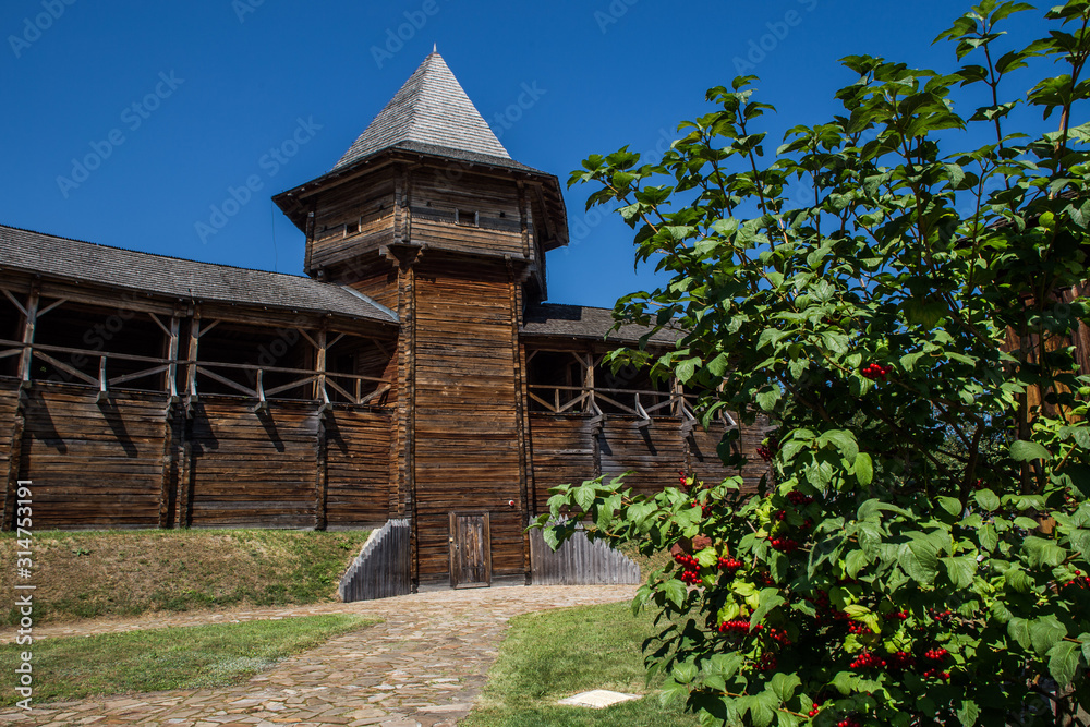 Wooden fortress wall and guelder rose inside Citadel of Baturin Fortress, Ukraine Wooden fortress wall and guelder rose inside Citadel of Baturin Fortress, Ukraine