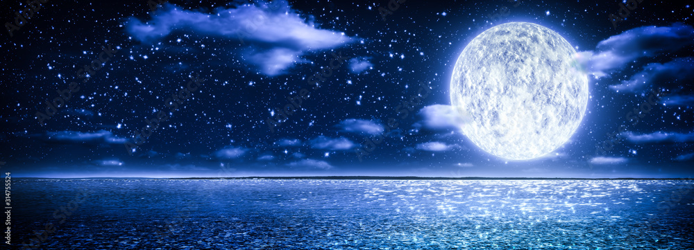 Obraz premium Romantic Moon With Clouds And Starry Sky Over Sparkling Blue Water
