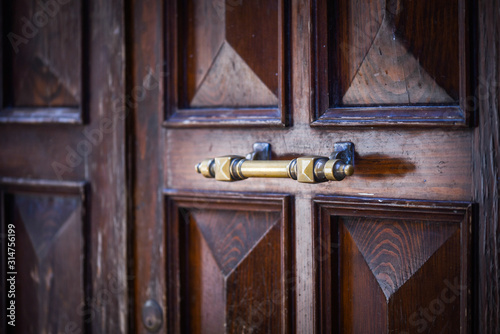 ancient doors close up within the historical streets of Rome