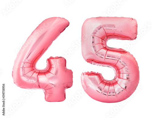 Number 45 forty five made of rose gold inflatable balloons isolated on white background. Pink helium balloons forming 45 forty five number