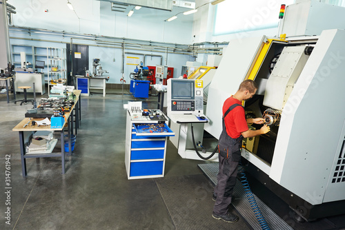 industrial worker at tool workshop at factory