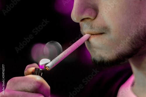 cigarette in the man's hand