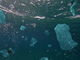 Toxic plastic waste floating underwater in the ocean