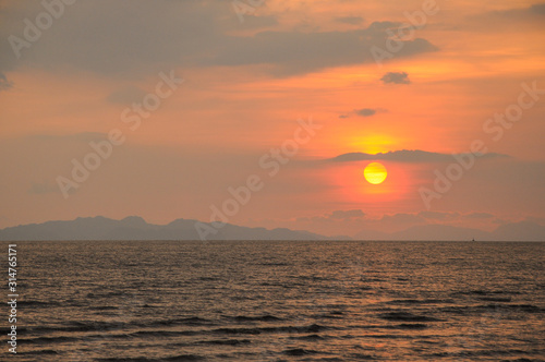 Beautiful sunsets view over the ocean. © MUHAMMADSYAZWAN