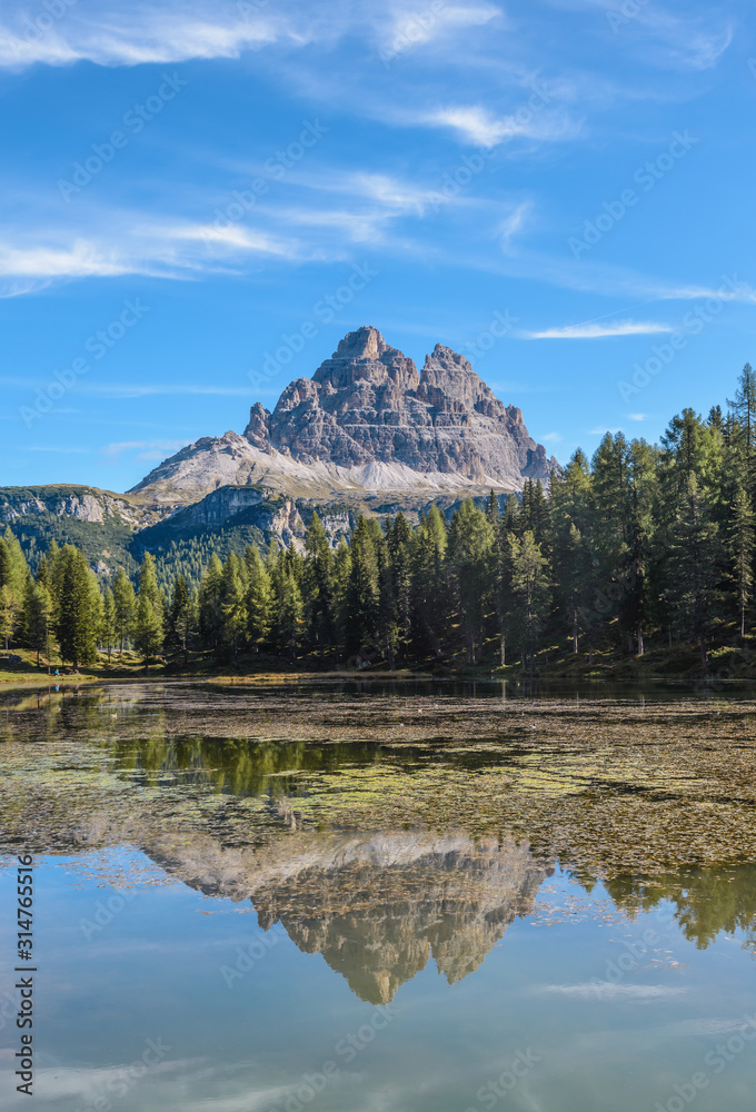 Tre Cime di Lavaredo, aka Drei Zinnen, reflection in water of Antorno Lake Dolomites, Italy.