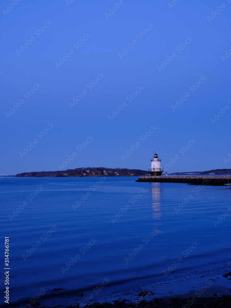 Sunset at the Spring Ledge Lighthouse on Casco Bay in South Portland Maine Sunset at the Spring Ledge Lighthouse on Casco Bay in South Portland Maine