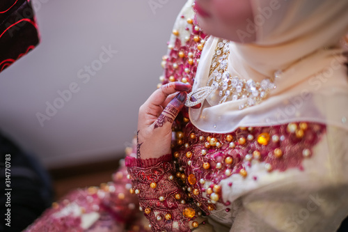 Very beautiful and unique henna paintings on both hands of the bride.