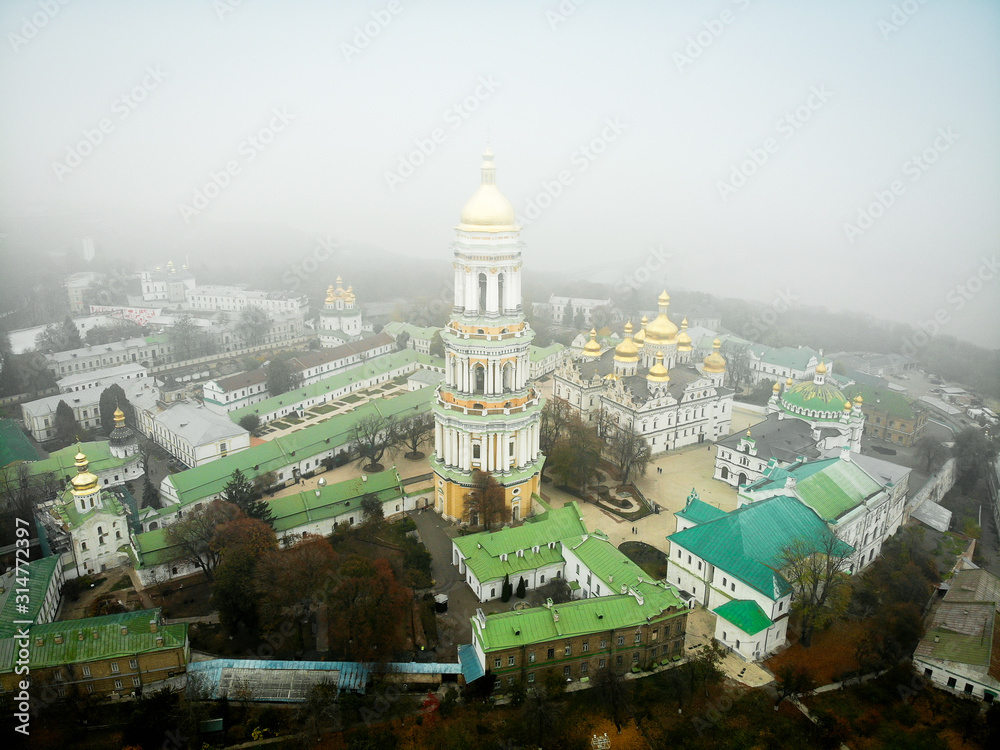 Foggy view of the Kyevo Pecherska Lavra Monastery in Kiev, Ukraine, Fog Autumn Winter Dramatic weather