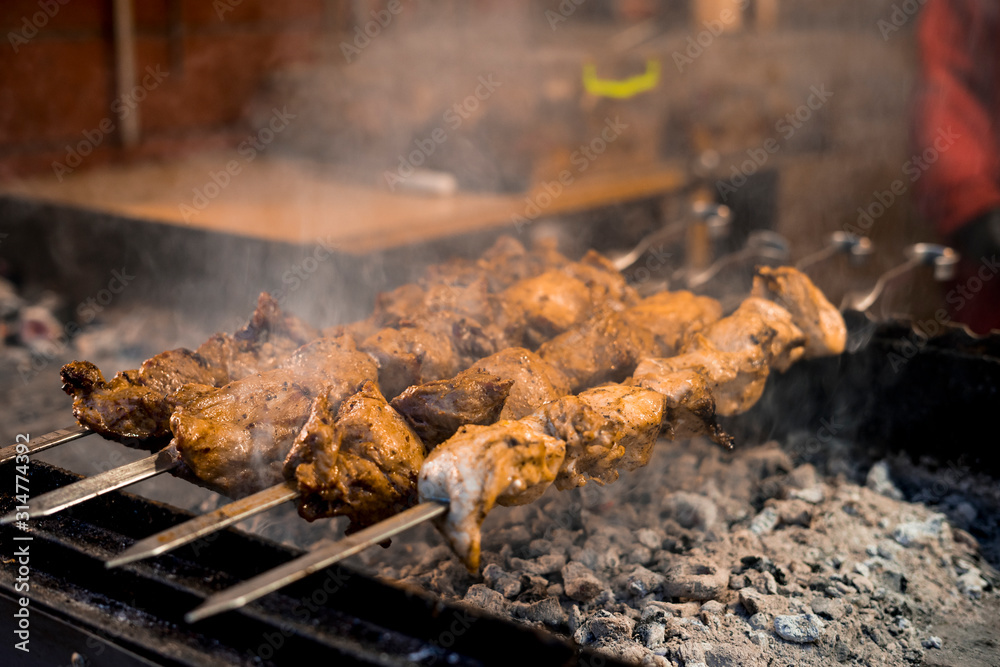 Cooking homemade barbecue on an open fire. Street Food Festival. Cooking homemade barbecue on an open fire. Street Food Festival.