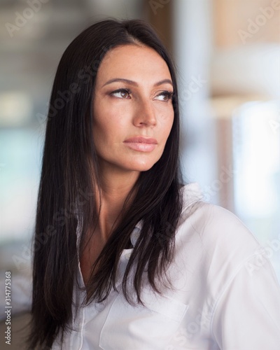 portrait of a young beautiful woman in a white shirt