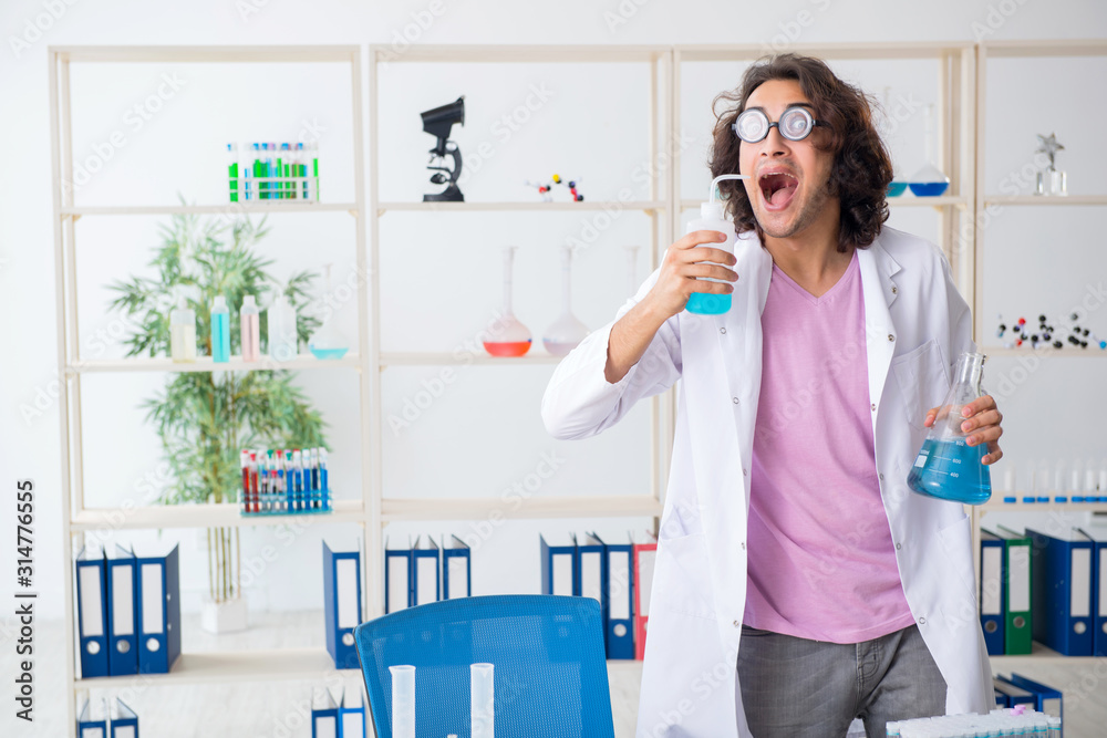 Funny male chemist working in the lab Funny male chemist working in the lab