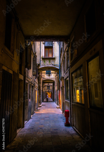 Narrow dark alleys of Venice during the day