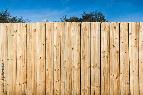 Pine wooden fence close up background