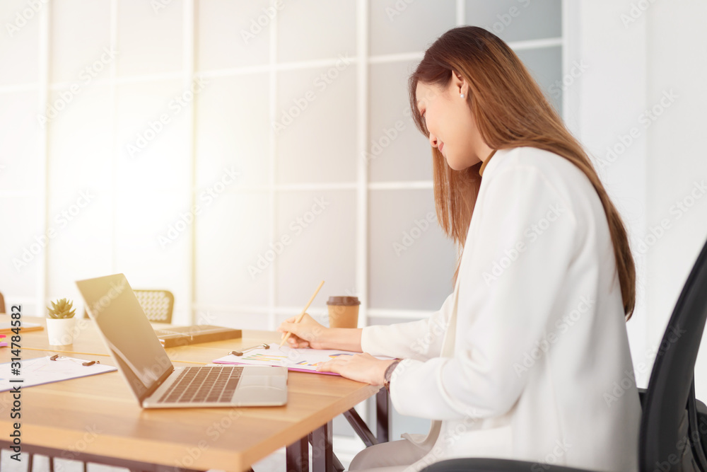 smart asian officer write report on paper, she sitting and feeling happy in work time, strategy analyze and information data research, happiness organization smart asian officer write report on paper, she sitting and feeling happy in work time, strategy analyze and information data research, happiness organization