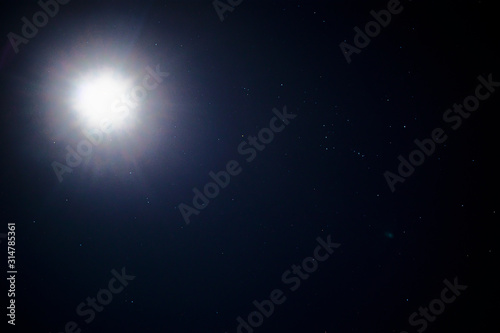 Photography of space, stars from the earth. Black galaxy, moon and moonlight. © Дарья Шуйскова