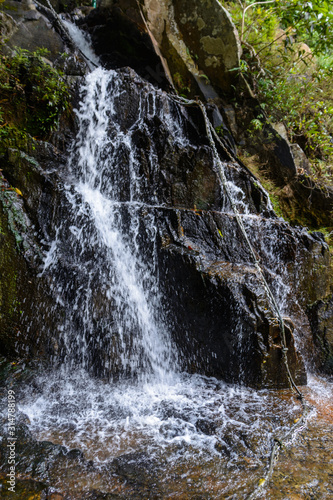 The beautiful waterfalls, rapids and mountain streams in the tropical forest in Yanoda Park, Sanya city. Hainan, China.