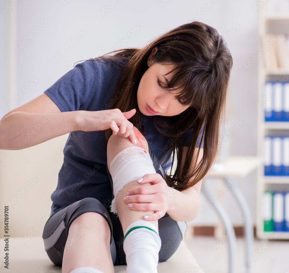 Patient visiting doctor after sustaining sports injury Patient visiting doctor after sustaining sports injury