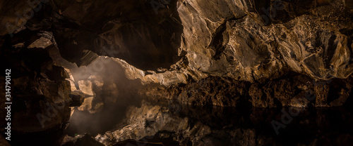 Tablou canvas Grjotagja Underground cave with river