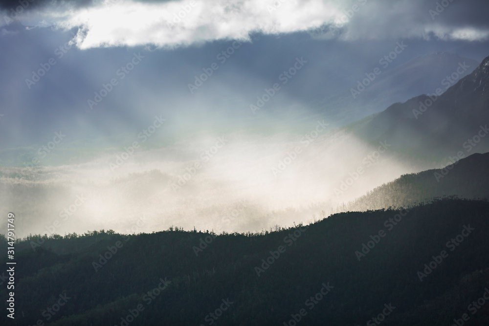Heavenly light over dramatic mountains in Tasmania, Australia