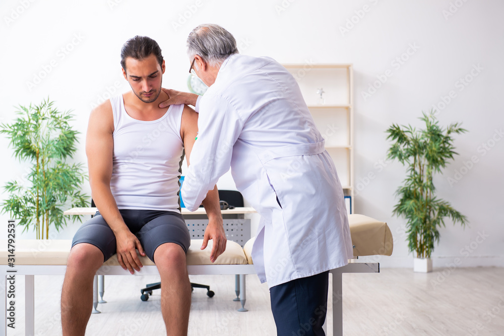 Young male patient visiting experienced doctor Young male patient visiting experienced doctor