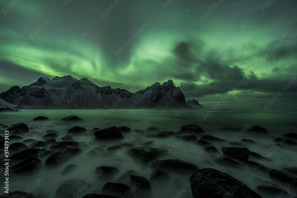 Aurora Borealis (Northern Lights) above Stokksnes Beach and Vestrahorn Mountains, Iceland