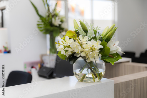 Doctors surgery reception desk flowers