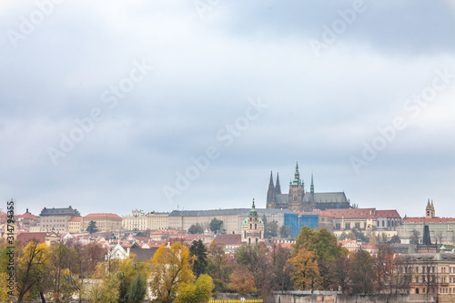 Panorama of the Old Town of Prague  Czech Republic  in autumn  at fall  with Hradcany hill and the Prague Castle with the St Vitus Cathedral  Prazsky hill  seen from Vltava river.
