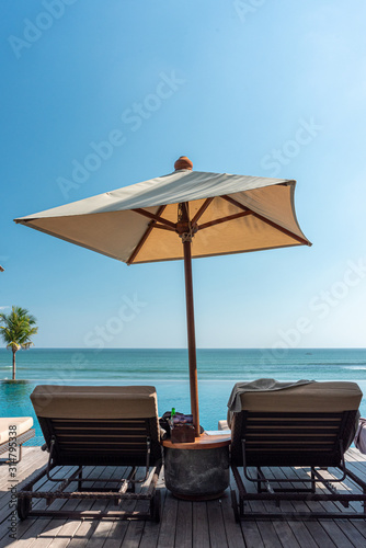 deck chairs and umbrella at a beach resort in bali © peter