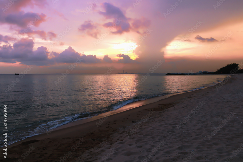 Colorful  of the beach sunset light and beautiful clouds on background