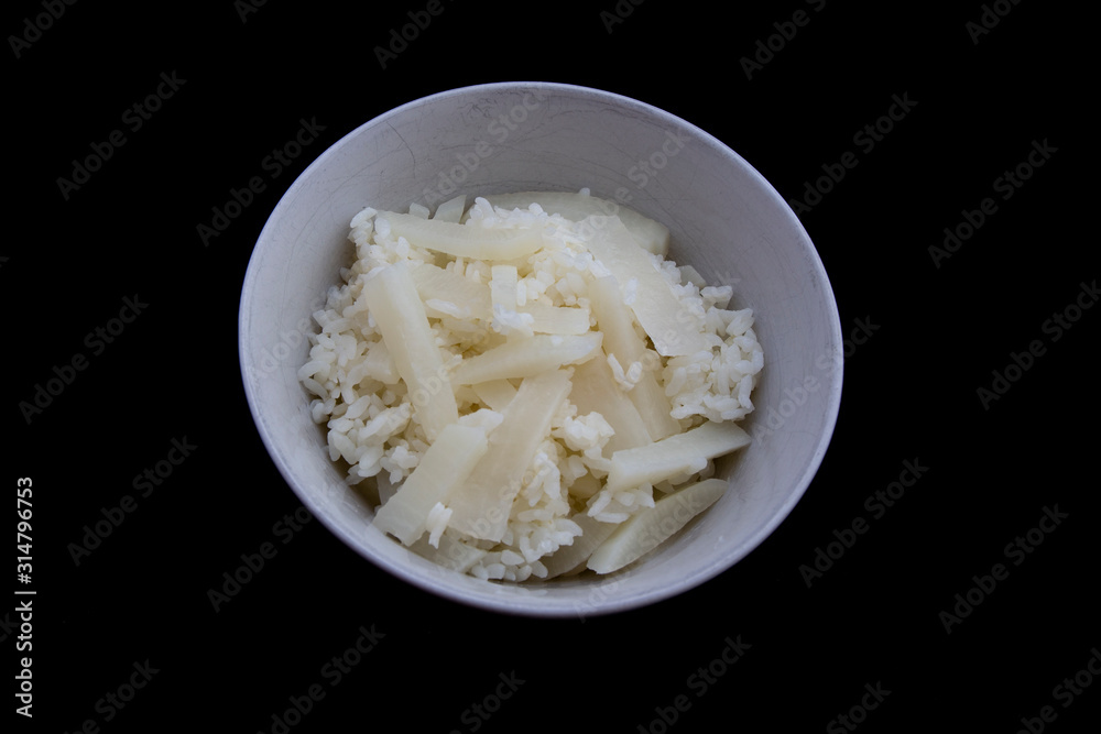 Cooked radish with rice which is called mubap in Korean Cooked radish with rice which is called mubap in Korean